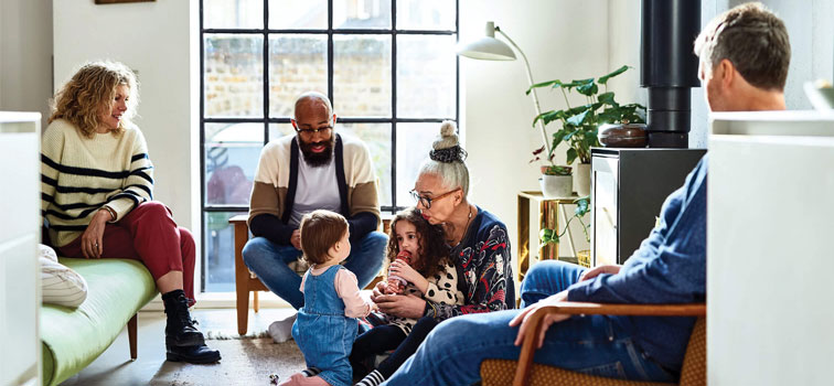 Family gathered around in house