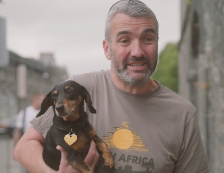 Man holding dog