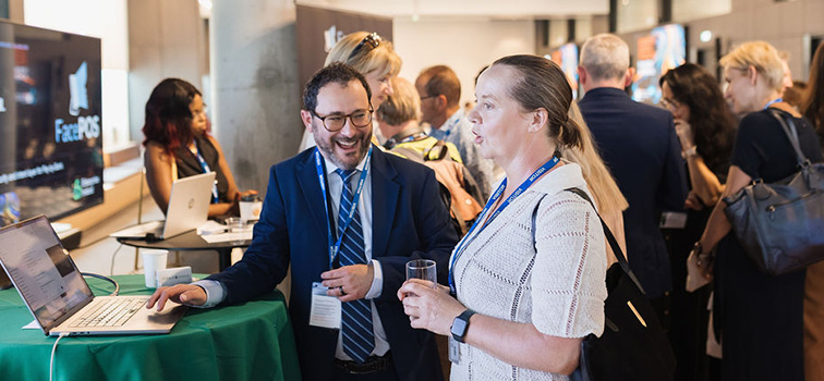 Attendees of the  Sandbox Programme Event at Central Bank of Ireland smiling and talking to each other