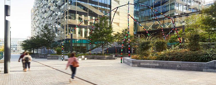 A few people walking on pathway at Central Bank of Ireland building