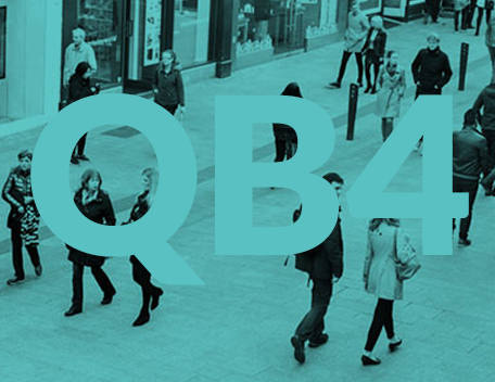 People walking on a street with a green monochrome shade with QB4 written on image