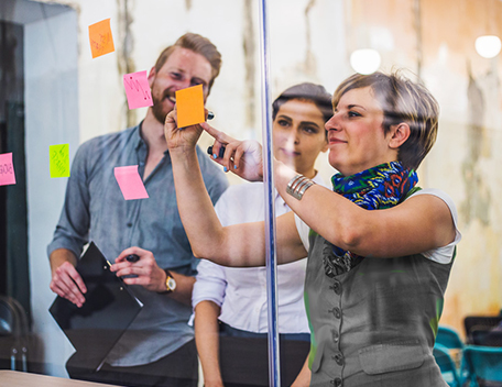 Colleagues using post it notes