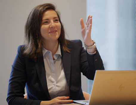 Smiling woman giving a business presentation