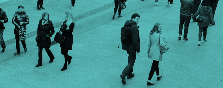 People walking on street with green background